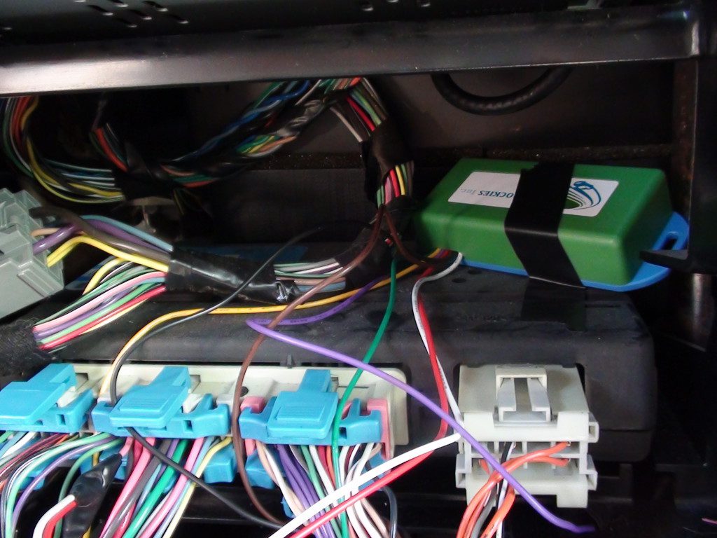 Close-up of the NEWROCKIES PRO Module wired into the connectors during Vanessa Rosa's self-install