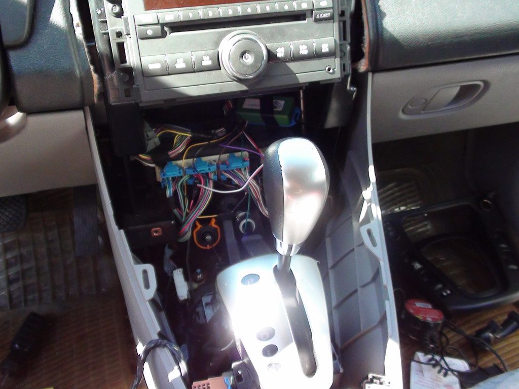The center console of Vanessa Rosa's Saturn Vue partially disassembled to reach the wiring during the PRO Module install