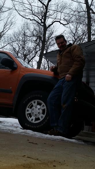 Ryan Cogle's orange 2007 Chevrolet Colorado with the NEWROCKIES PRO Module installed, parked outside in winter