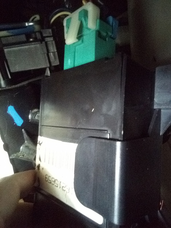 Close-up of the factory GM PASS-Key/TDM anti-theft module behind the glovebox of a 1997 Oldsmobile 88 - the source of the Passlock-style no-start problem before the NEWROCKIES PRO Module bypass