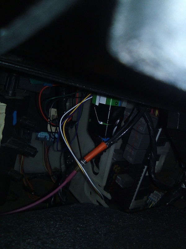 Wiring exposed under the dashboard during a NEWROCKIES PRO Module Passlock bypass installation on Regina's 1997 Oldsmobile 88