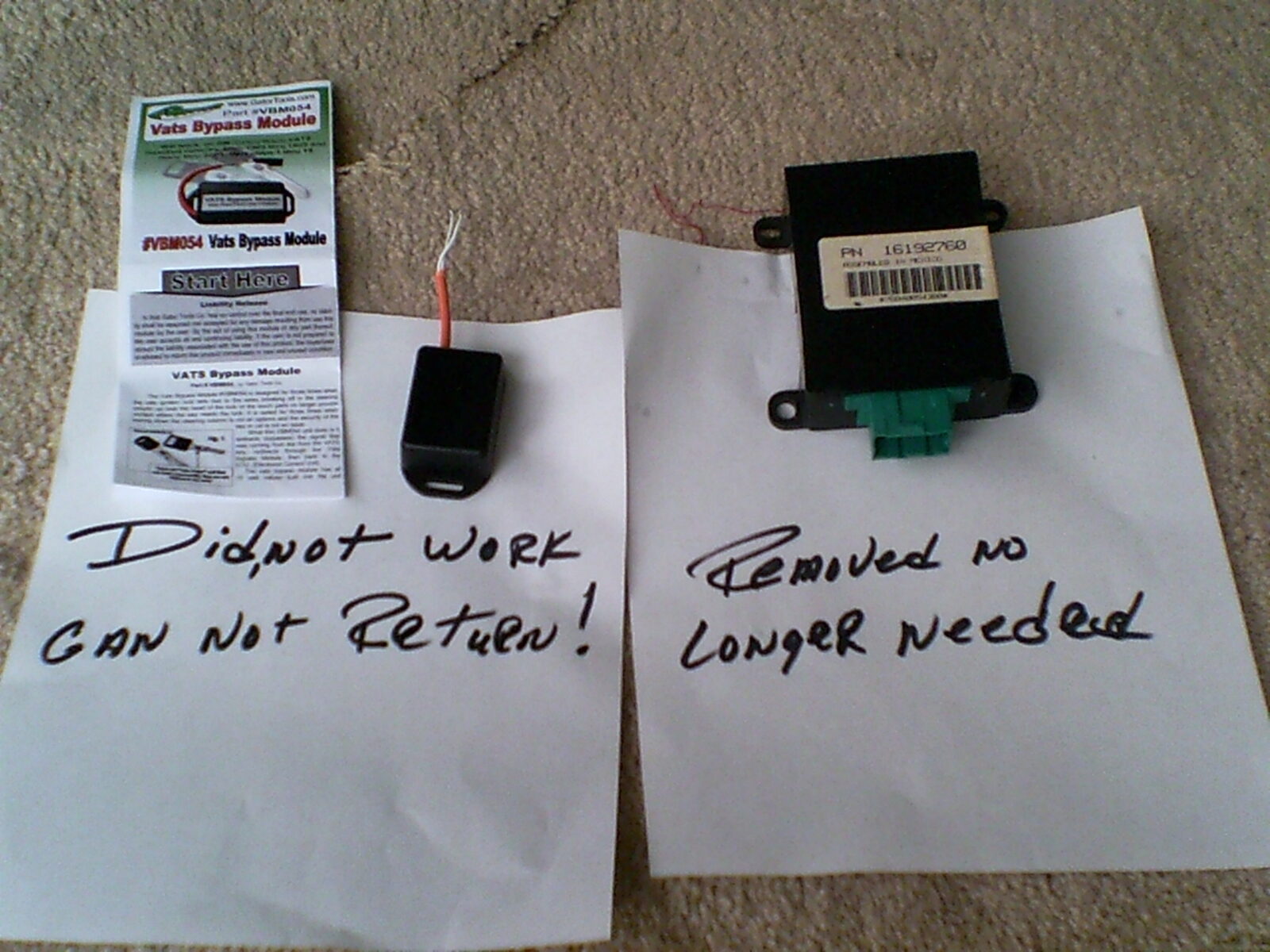 Two modules laid out side by side with handwritten labels: the failed aftermarket bypass marked "Did not work, can not return", and the factory GM PassKey decoder marked "Removed, no longer needed"
