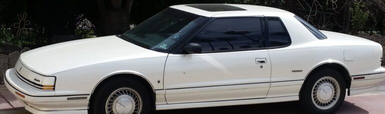 White two-door 1992 Oldsmobile Toronado parked outdoors