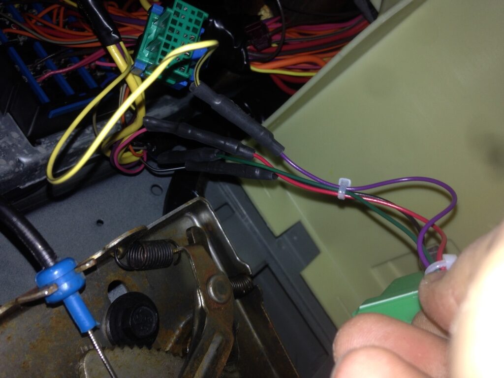 The finished wiring with the green module mounted in the Impala SS