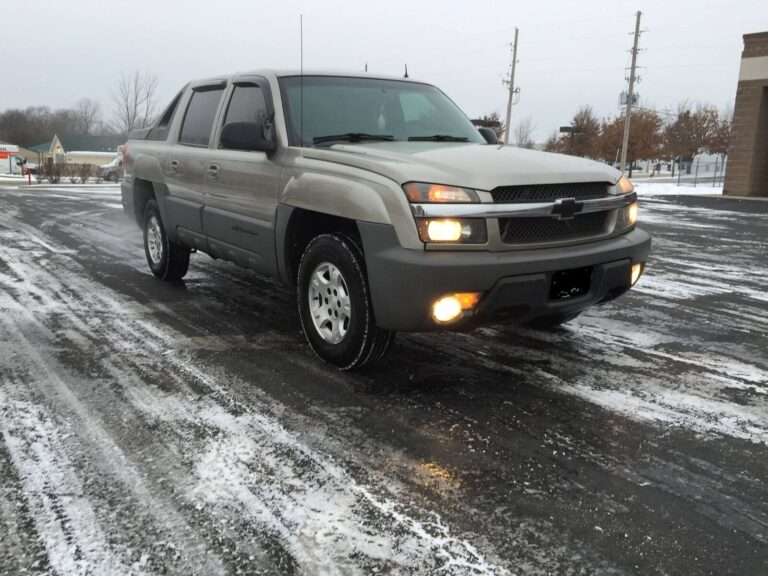 Jerrald's tan Chevrolet Avalanche parked in a snowy lot
