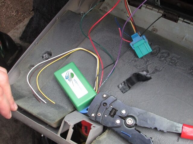 The green NEWROCKIES module, wires, connector and crimping tool laid out before the install