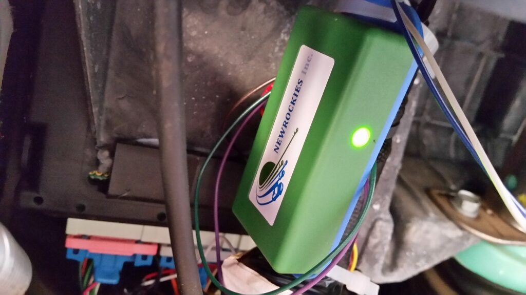 The green NEWROCKIES PRO Module wired in with its green LED illuminated