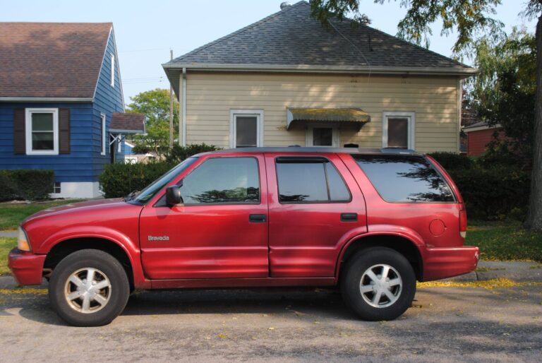 Scott's red Oldsmobile Bravada parked on a residential street