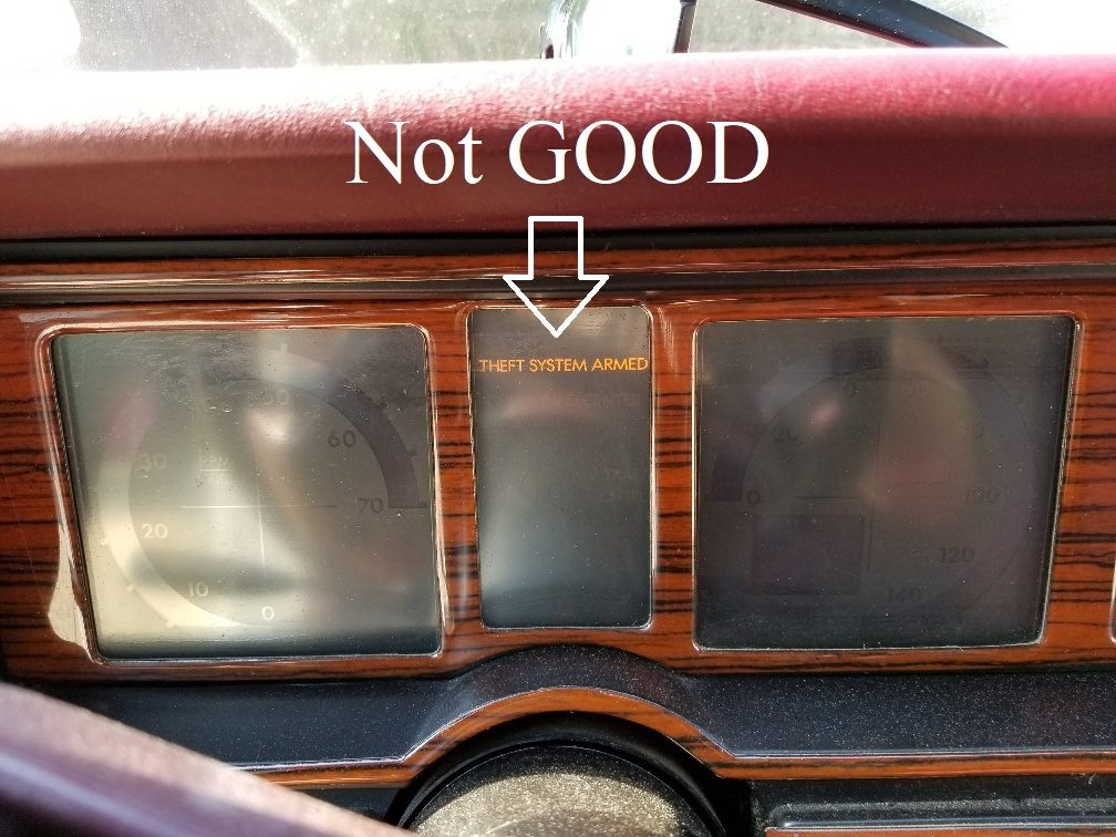 Cadillac Allante dashboard with the THEFT SYSTEM ARMED warning light illuminated