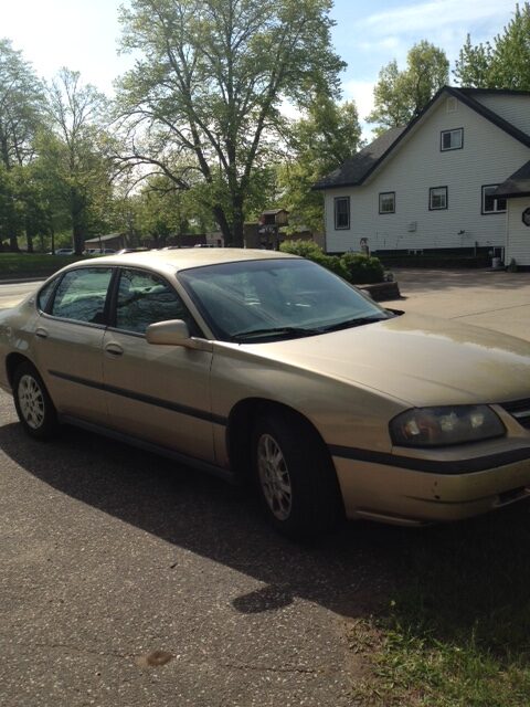 Steve's gold 2004 Chevrolet Impala parked outside his house