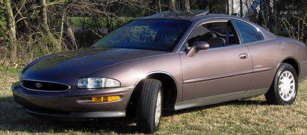 The 1995 Buick Riviera parked on the grass